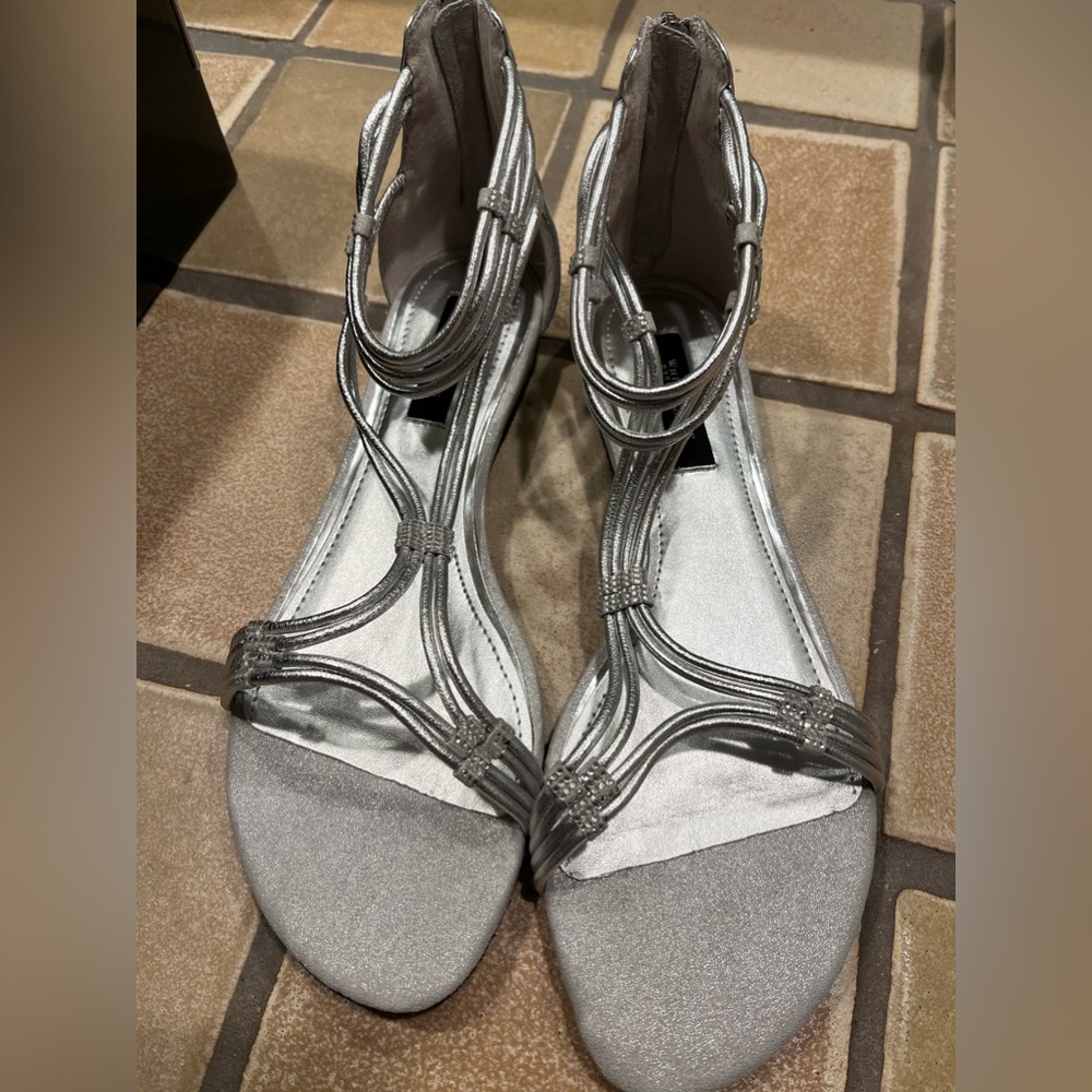 Brand new. Size 9 1/2 silver White House, Black market sandal